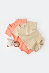 Body manches courtes pour bébé couleur rose claire crème en 100% coton biologique GOTS interlock Slow fashion vêtement bio bébé éthique durable éco-responsable